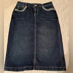 Denim skirt; 75% cotton, 23% polyester, 2% spandex.  Below the knee, never worn